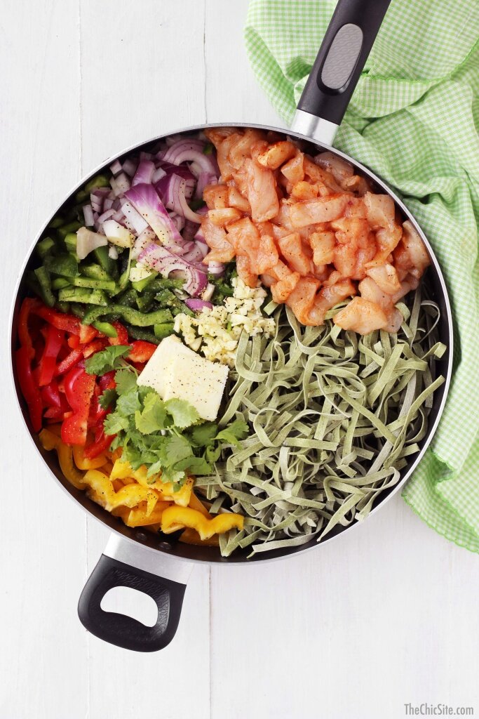 Fajita pasta ingredients placed separate within a single pot