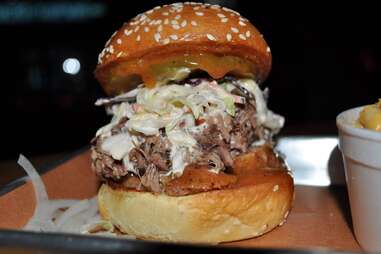 Brioche burger stuffed with pulled pork and slaw