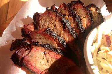 Sliced brisket lying on wax paper