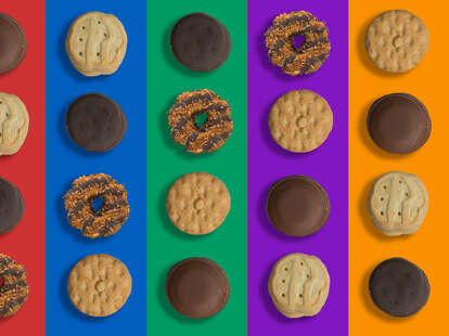 Assorted girl scout cookies on colorful background