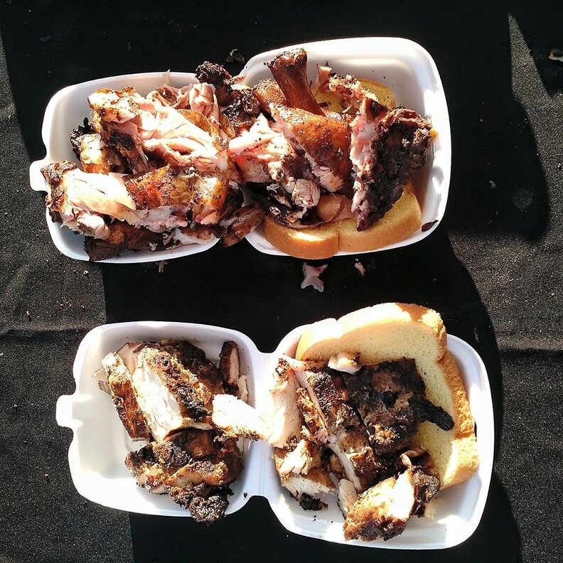 Chicken wings and slices of bread in styrofoam containers