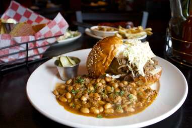 Maxie's Barbecue pork sandwich close up with beans