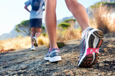 man and woman hiking outside