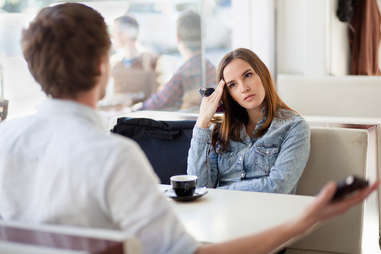 Couple in a cafe having a conversation or argument