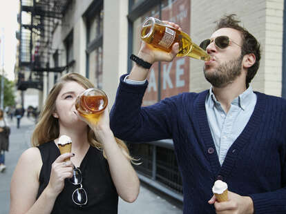 young people drinking 40s and eating ice cream outside public drinking beer