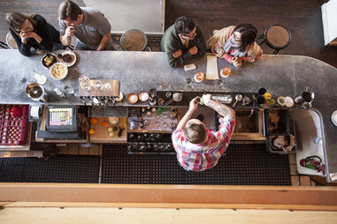 overhead shot of bartender at clyde common