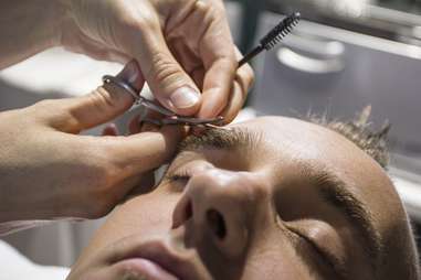 Man getting eyebrows clipped at Scottsdale spa