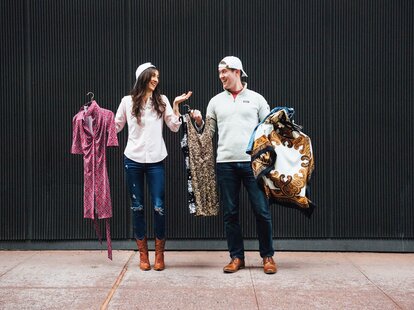 man and woman dressing each other