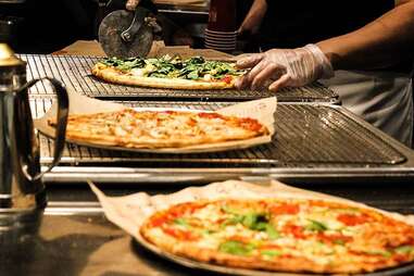 slicing a blaze pizza