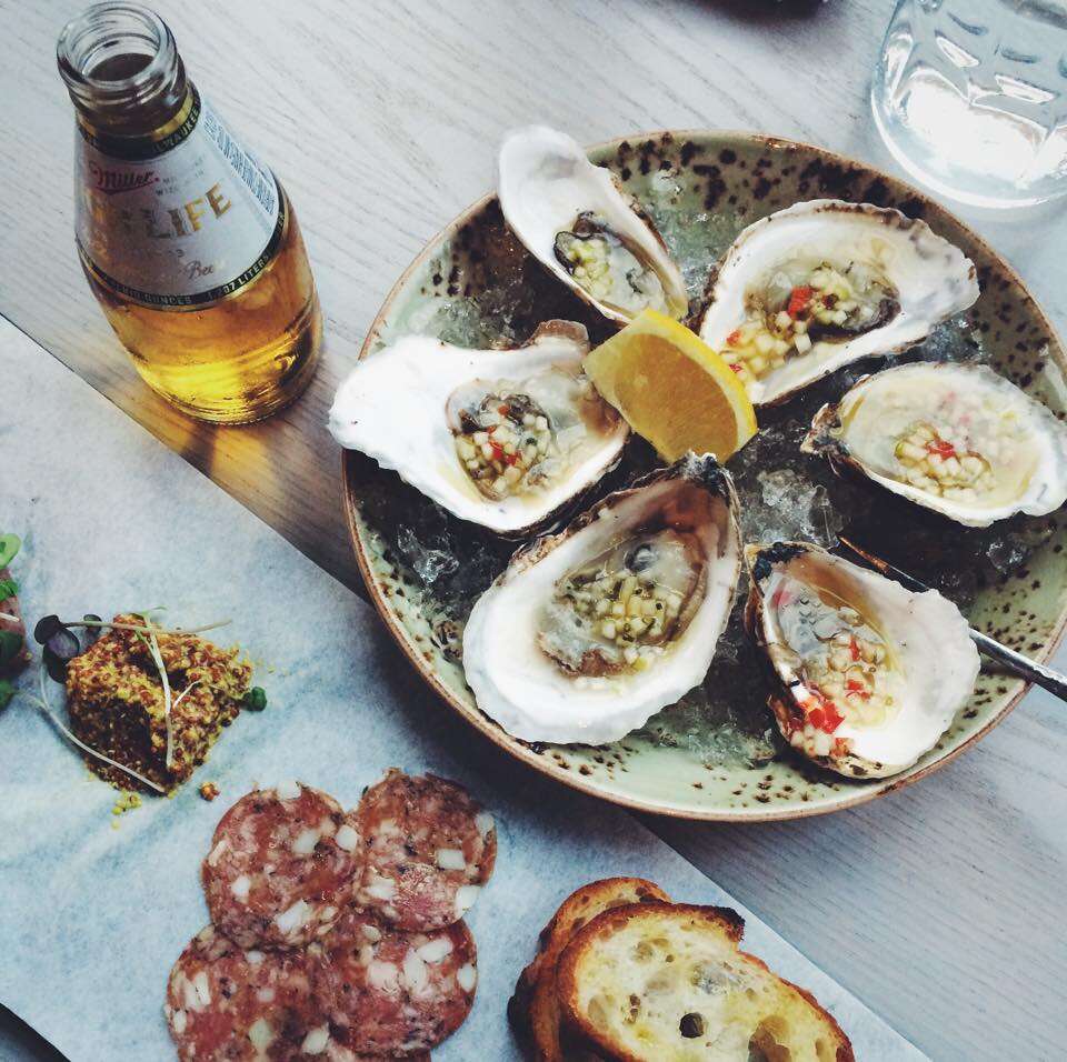 oysters beer and charcuterie at tavern road in boston