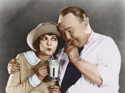 old fashioned photo a couple sharing a milkshake dating behaviors to reinstate