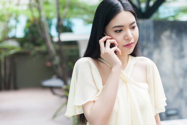 anxious woman on the phone