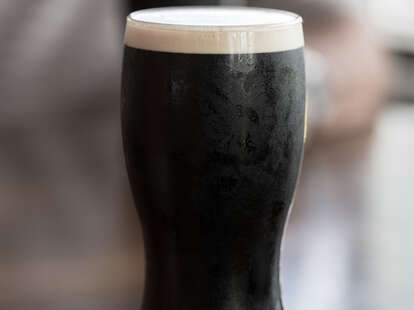 a pint glass of guinness