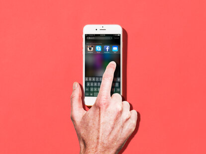 finger touching iPhone 6 screen