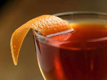 beverage with orange peel at Juniper Tar
