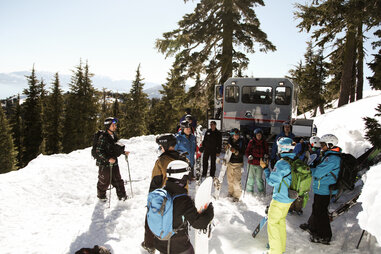 Skiers waiting outside Snowcat