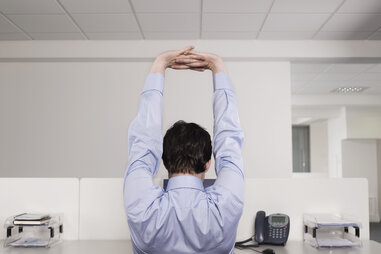 Office man stretching