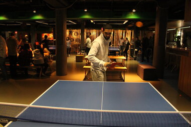 drake lookalike playing ping pong