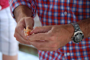 Man peeling crawfish