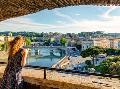 woman looking over scenic Rome, Italy