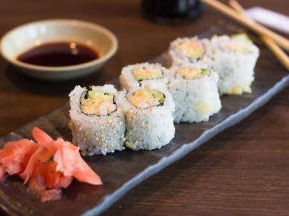 Sushi on a platter with ginger and soy sauce