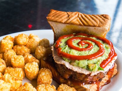 Guacamole toast with tater tots