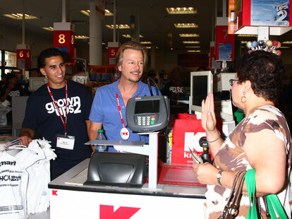 Fan talking to David Spade at register