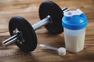 Protein shake with dumbbell
