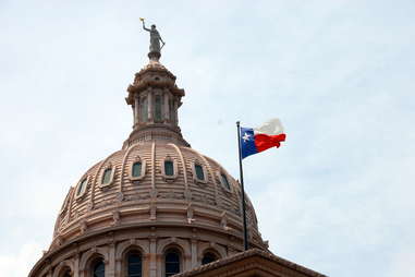 Texas Capitol building with Lone Star State flag