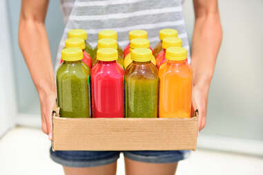 woman with juices for cleanse