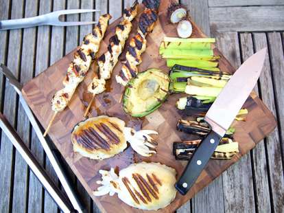 Avocado and chicken on cutting board