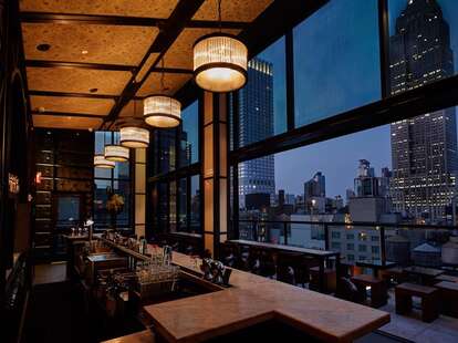 Spyglass Rooftop NYC interior floor to ceiling windows nyc skyline view