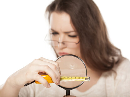 woman inspecting a ruler sex tips for boring people