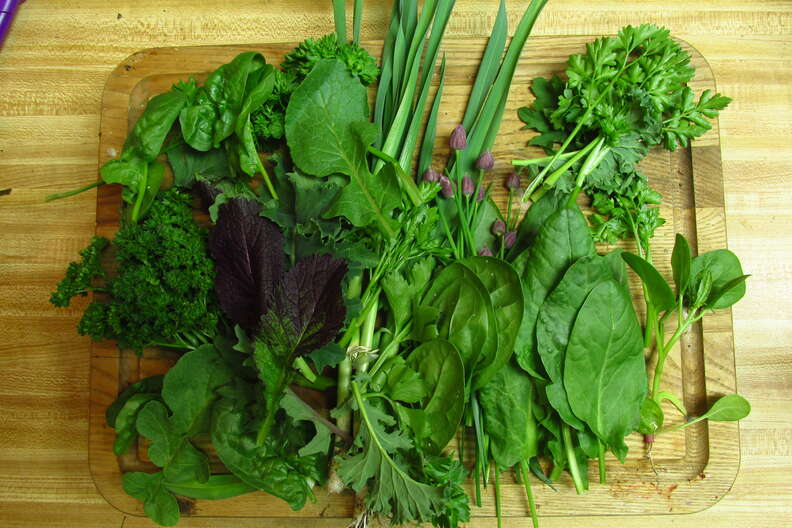 garden greens on cutting board making gumbo