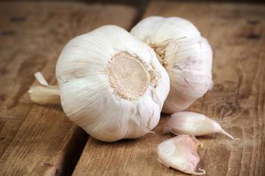 close up head of garlic and cloves