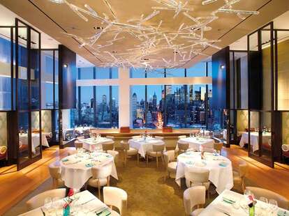 Mandarin Oriental, New York dining room new york skyline floor to ceiling windows 
