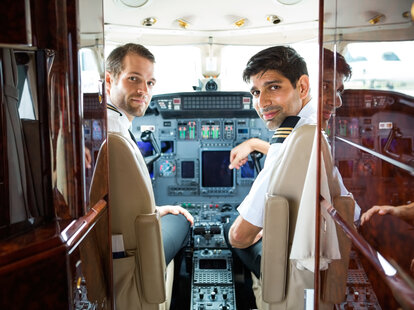 airplane pilots in the cockpit