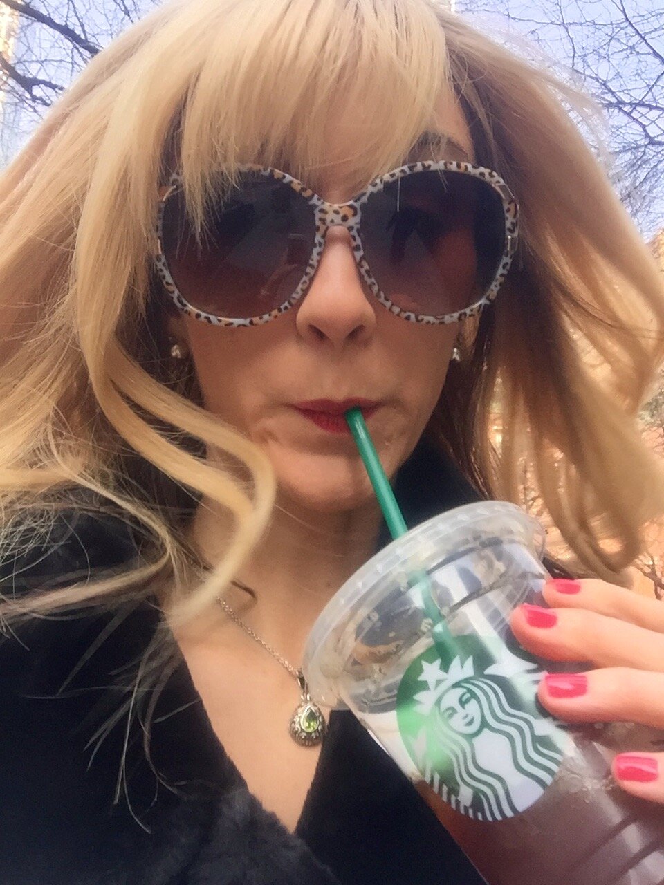 blonde woman with starbucks cup