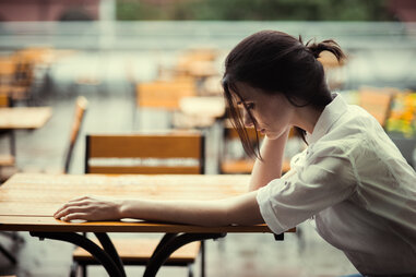 sad woman in a cafe