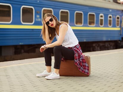 woman frustrated waiting for a train