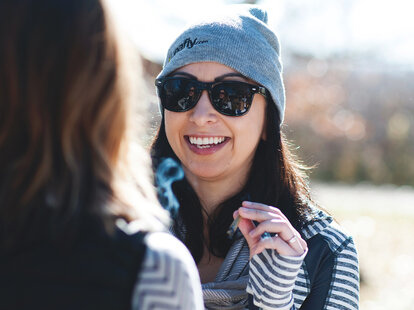 woman smoking weed and laughing