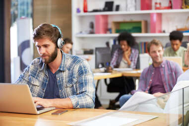man listening to music at work