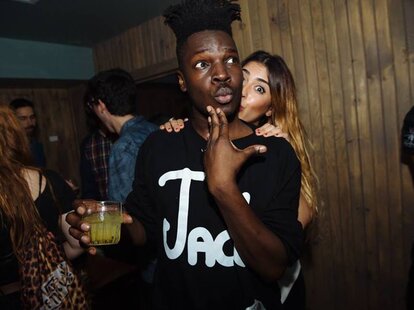 DL Jones at party with drink