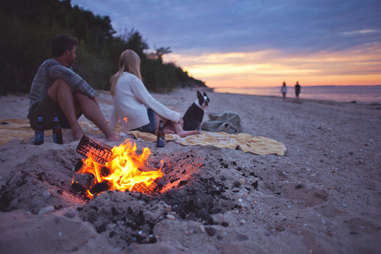 Hamptons beach bonfire couple and dog