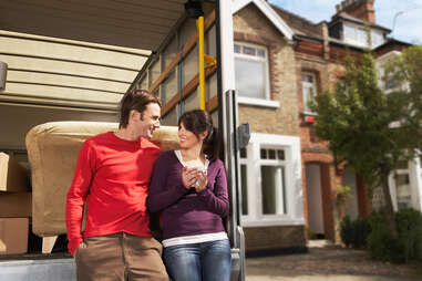 Couple in front of a new home