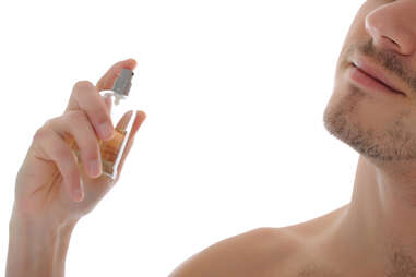 Man spraying cologne