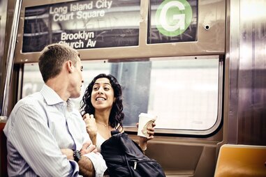couple on subway in new york city nyc