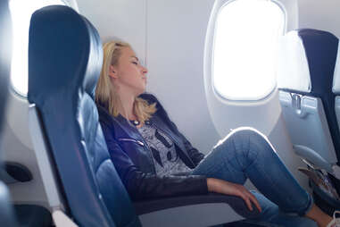 woman sleeping on plane