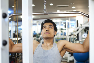 Man doing lat pull down