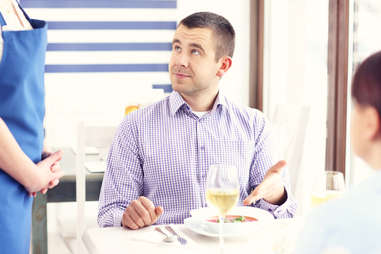 man unhappy with food at restaurant